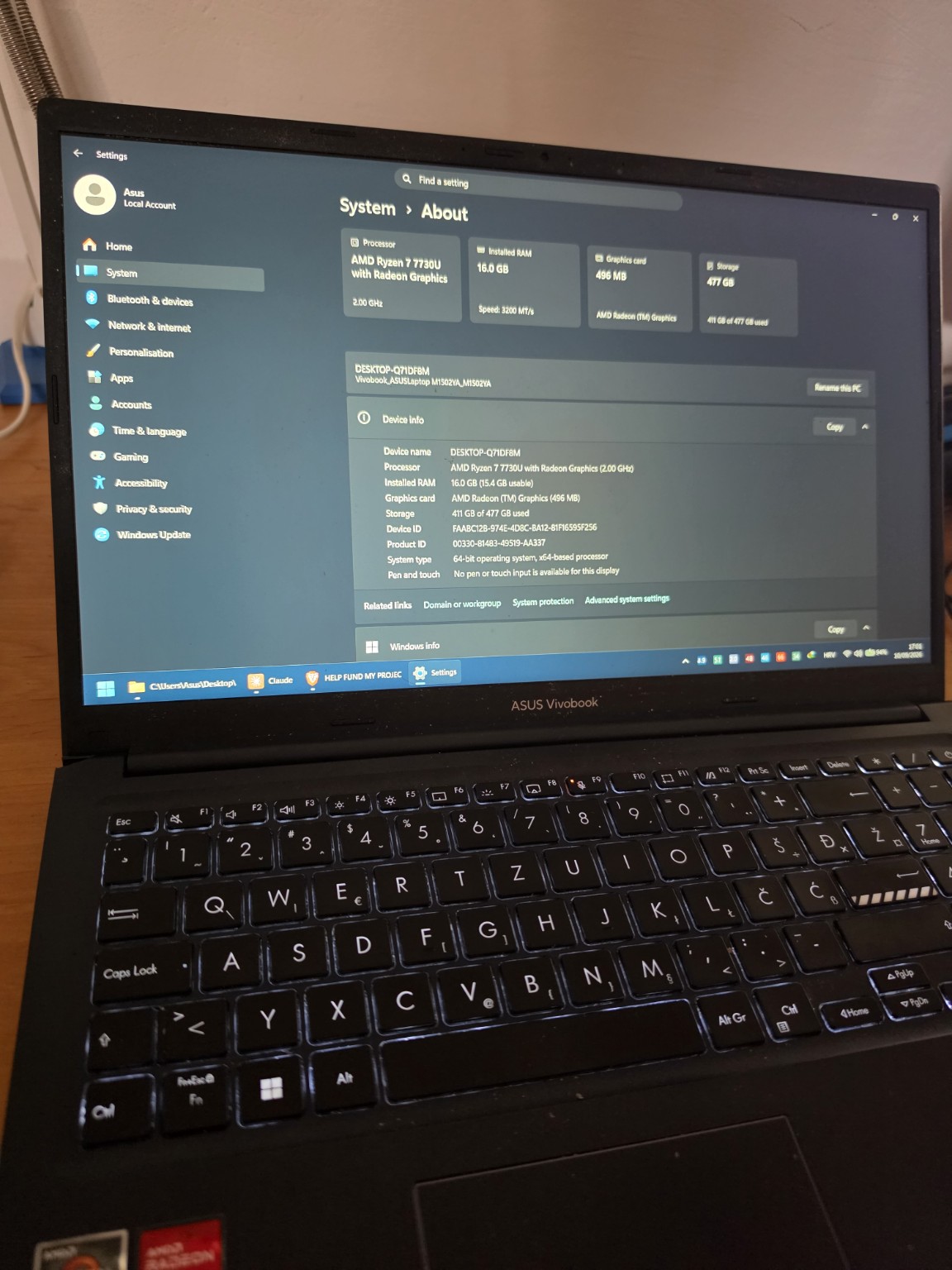 The current ASUS VivoBook, open on the Windows 'About' screen showing Ryzen 7 7730U, 16 GB RAM and integrated AMD Radeon graphics